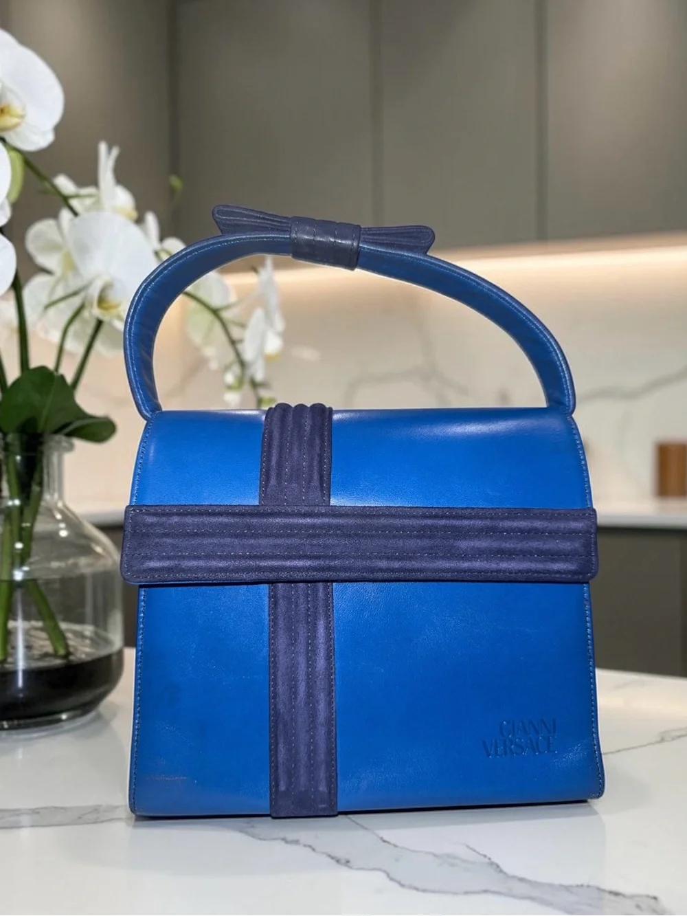 Vintage Gianni Versace blue leather top handle bag ribbon bow